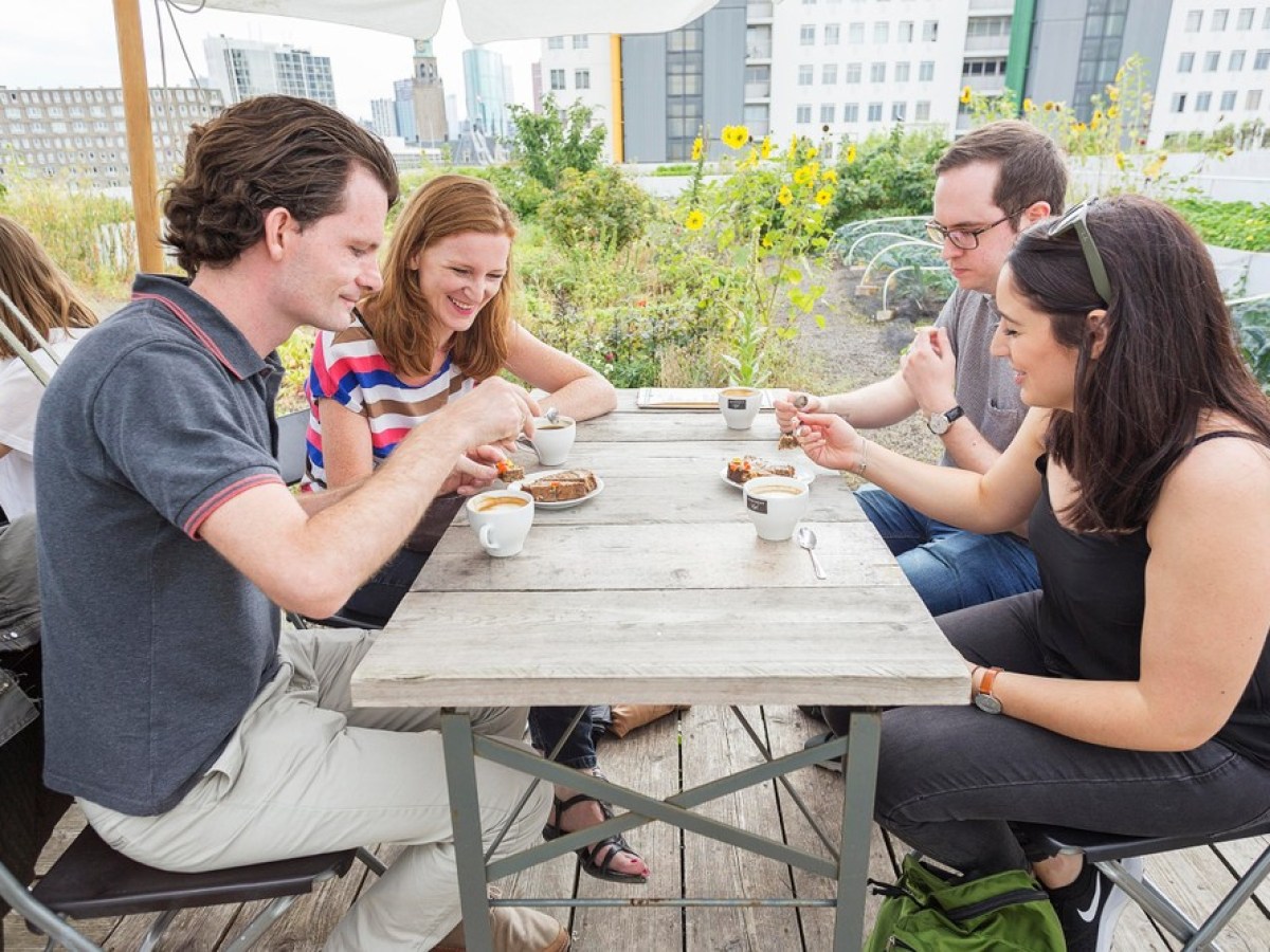 a group of people eating at a picnic table